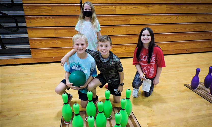 Students bowl in PE class